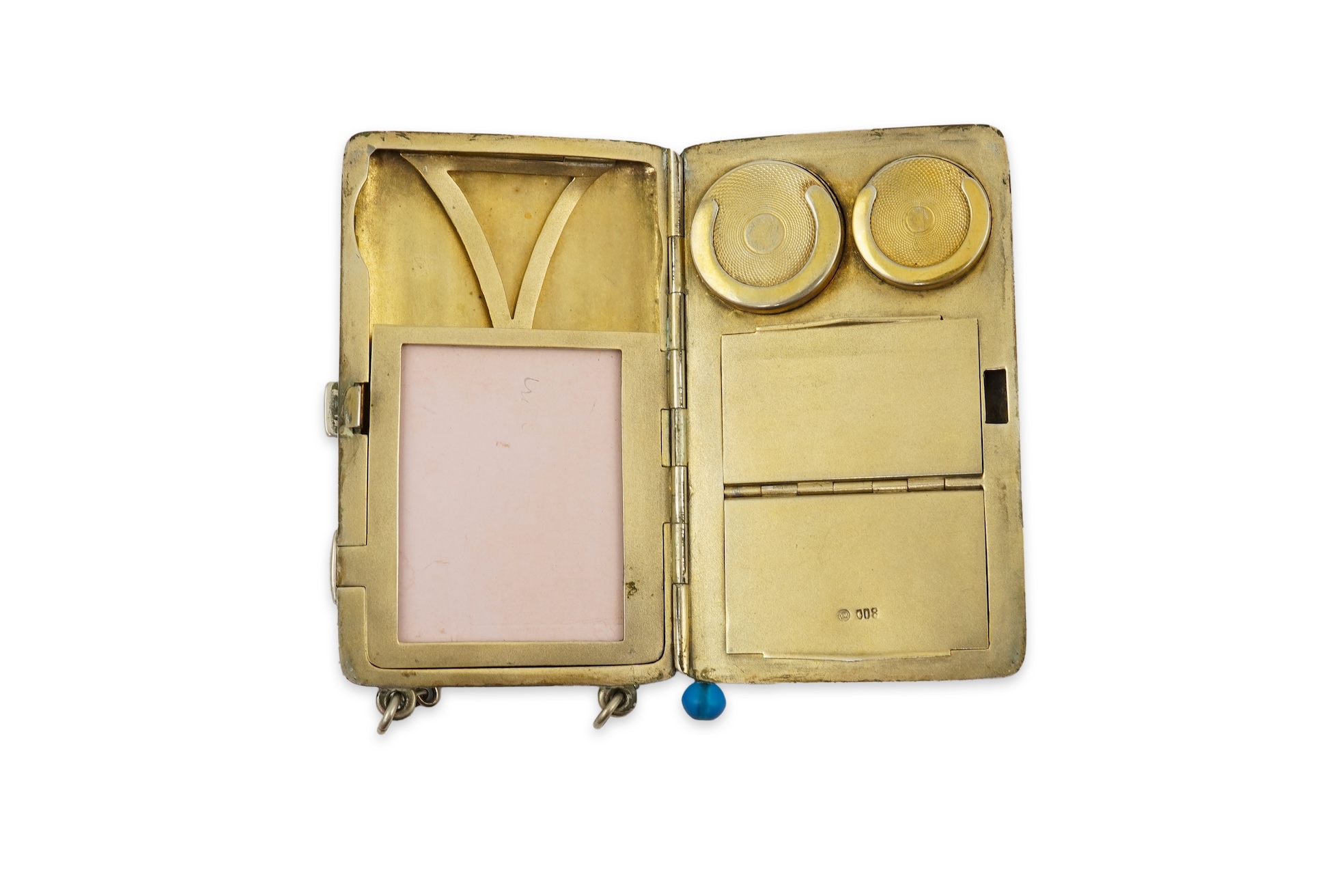 An early 20th century continental 800 standard silver combination, card, coin, aide memoir and pill case, with pencil and ribbed decoration, maker WK
